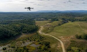 Drone LiDAR mapping over a wooded Virginia land development site with open terrain, access roads, and drainage features